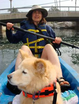 Mary kyaking with her dog